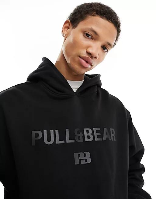 Pull & Bear tonal printed hoodie in black Cover