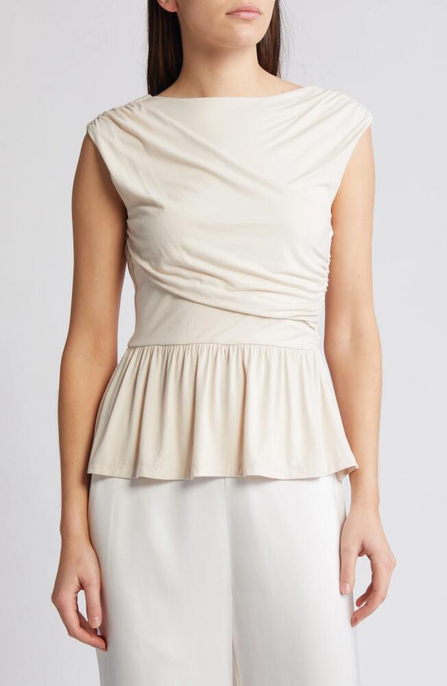 RUE SOPHIE Leona Asymmetric Back Peplum Top in Champagne Cover