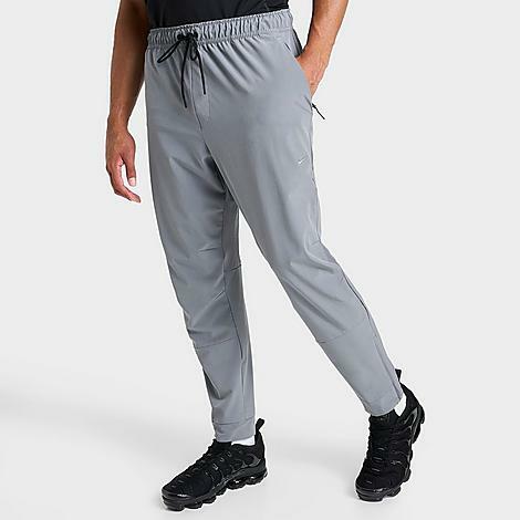 Nike Men's Dri-FIT Unlimited Tapered Leg Versatile Training Pants in Grey/Smoke Grey Cover