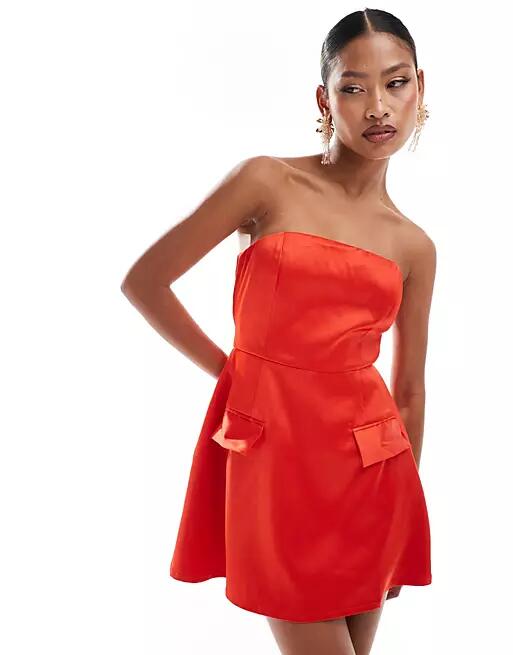 Heiress Beverly Hills exclusive premium structured bandeau satin pocket detail mini dress in red Cover