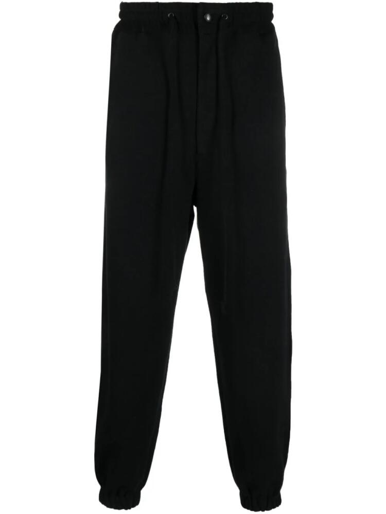 Junya Watanabe MAN drawstring-waist cotton track pants - Black Cover