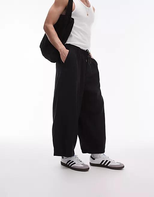 Topman wide leg cropped pants in black Cover