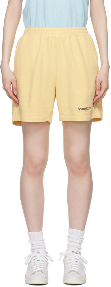 Sporty & Rich Yellow Serif Logo Gym Shorts Cover