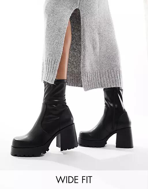 ASOS DESIGN Wide Fit Retreat mid-heeled sock boots in black Cover