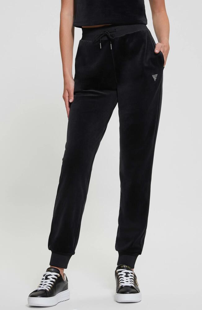 GUESS Couture Crystal Logo Embellished Velour Joggers in Jet Black Cover