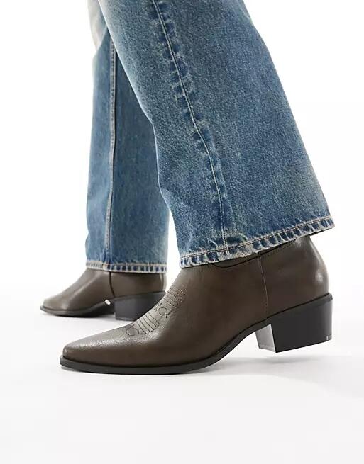 ASOS DESIGN cowboy boots in distressed brown Cover