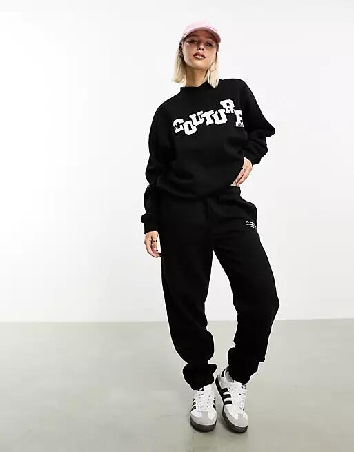 The Couture Club applique sweatpants in black Cover