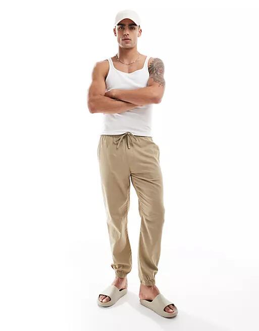 Pull & Bear linen look cuffed hem pants in sand-Neutral Cover