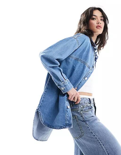 Bershka longline oversized denim shirt in mid blue Cover