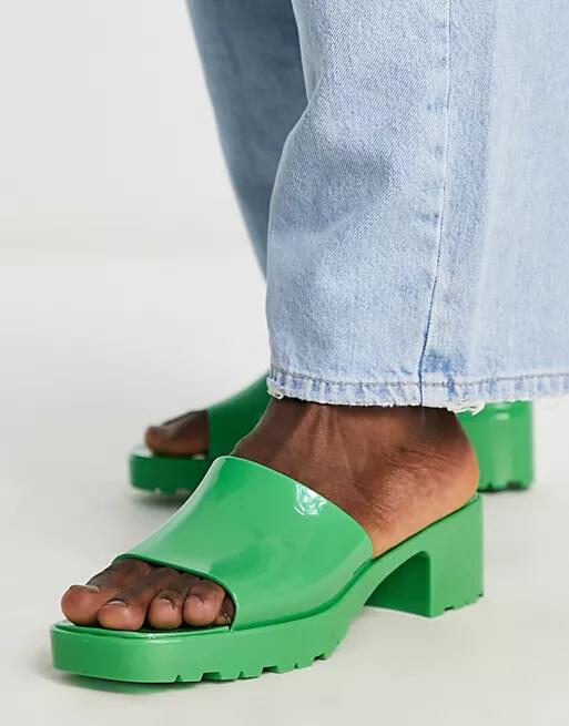 ASOS DESIGN heeled jelly mules in green Cover