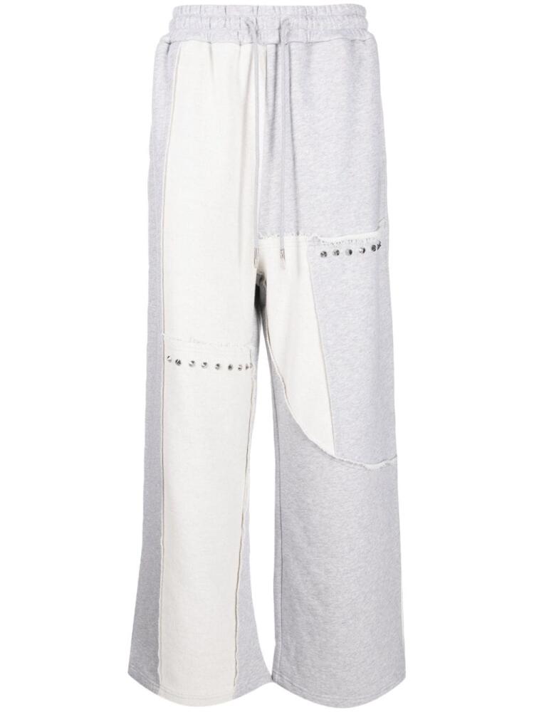 Feng Chen Wang patchwork track pants - Grey Cover