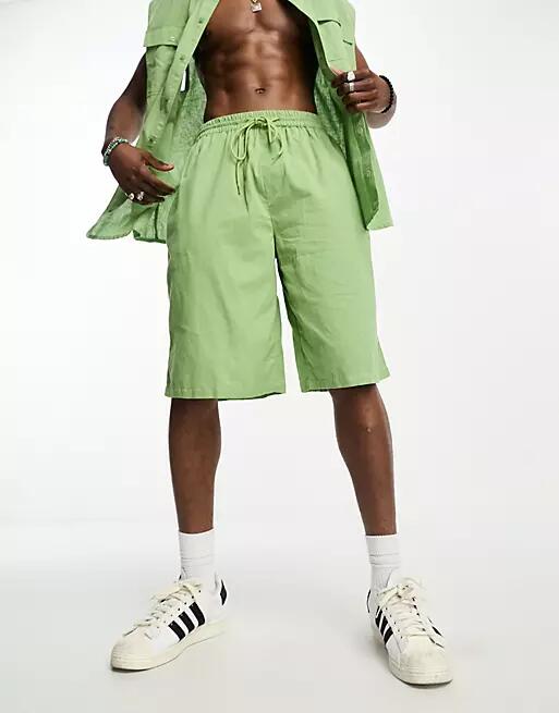 COLLUSION linen beach short in light green Cover