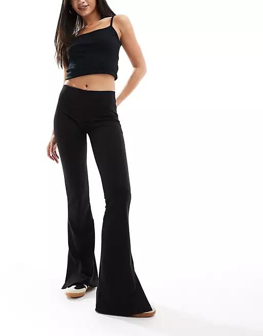 Bershka high waisted jersey flared pants in black Cover