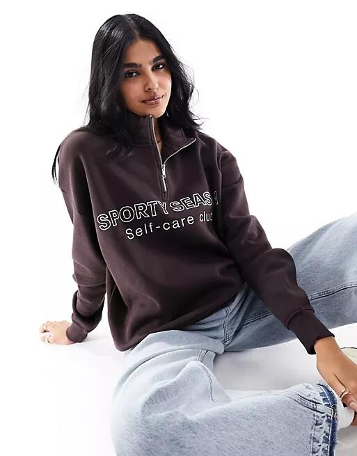 Pull & Bear 'Sporty Season' graphic half zip sweater in chocolate brown Cover