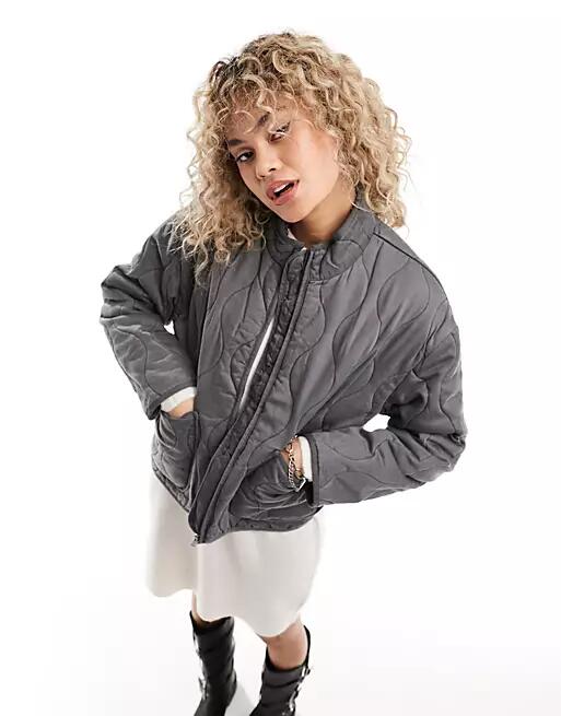 Only onion quilted jacket with oversized pockets in washed gray Cover