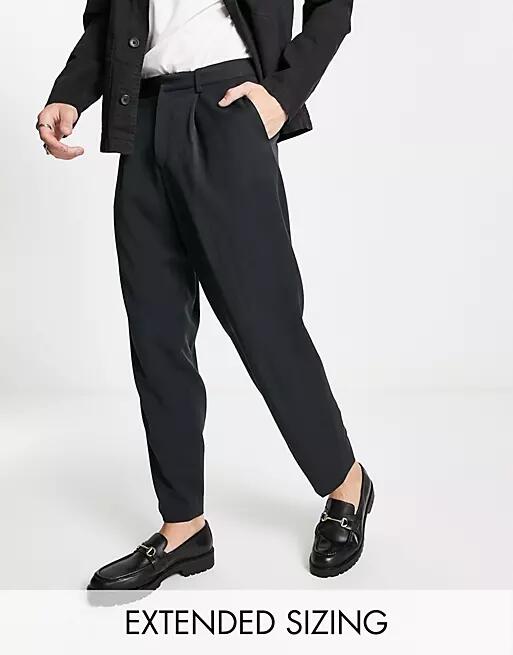 ASOS DESIGN oversized tapered smart pants in black Cover