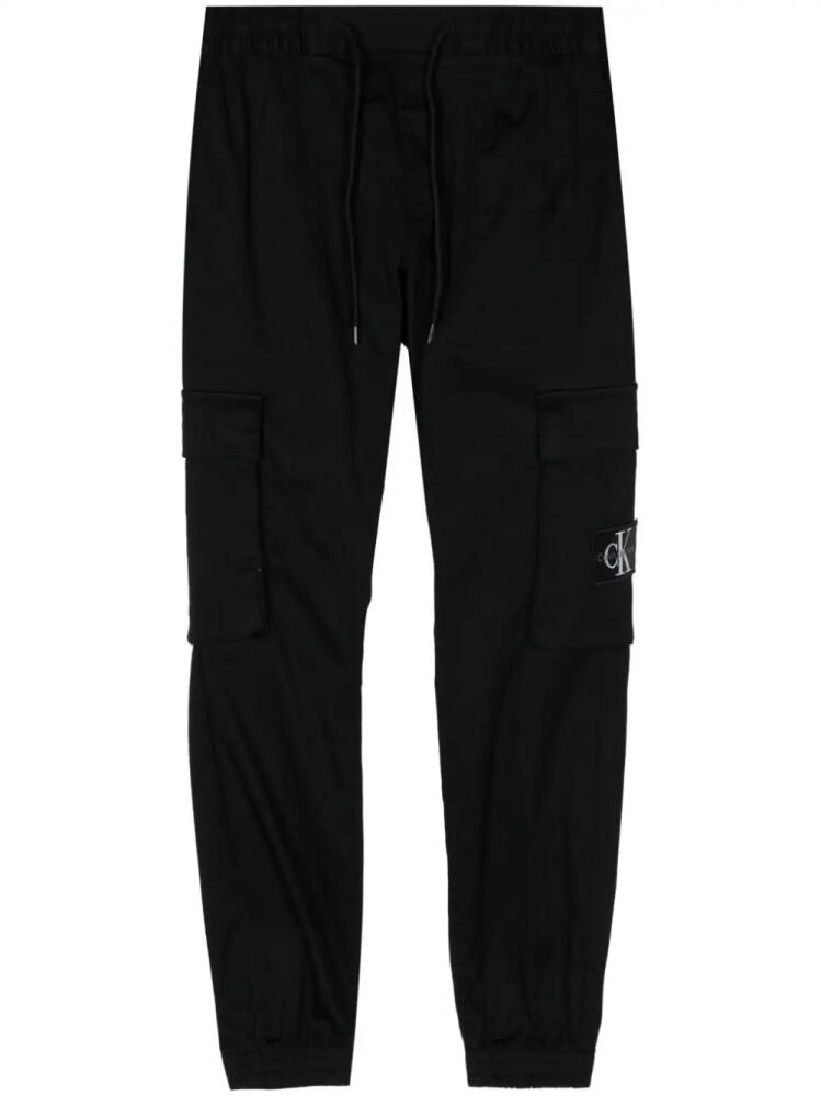 Calvin Klein logo-patch track pants - Black Cover