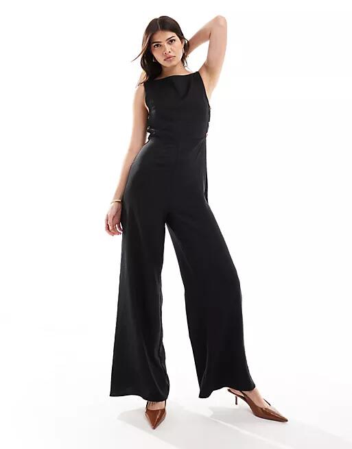 ASOS DESIGN high neck button side detailed wide leg jumpsuit in black Cover