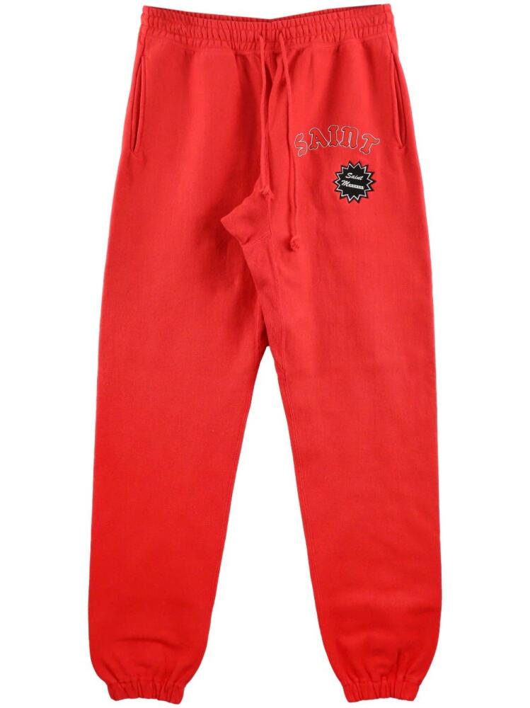 SAINT MXXXXXX logo-print cotton track pants - Red Cover