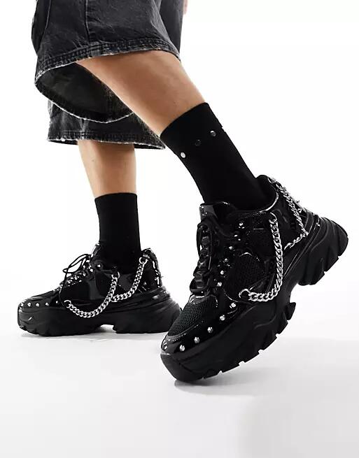 ASOS DESIGN chunky sneakers in black with studding Cover