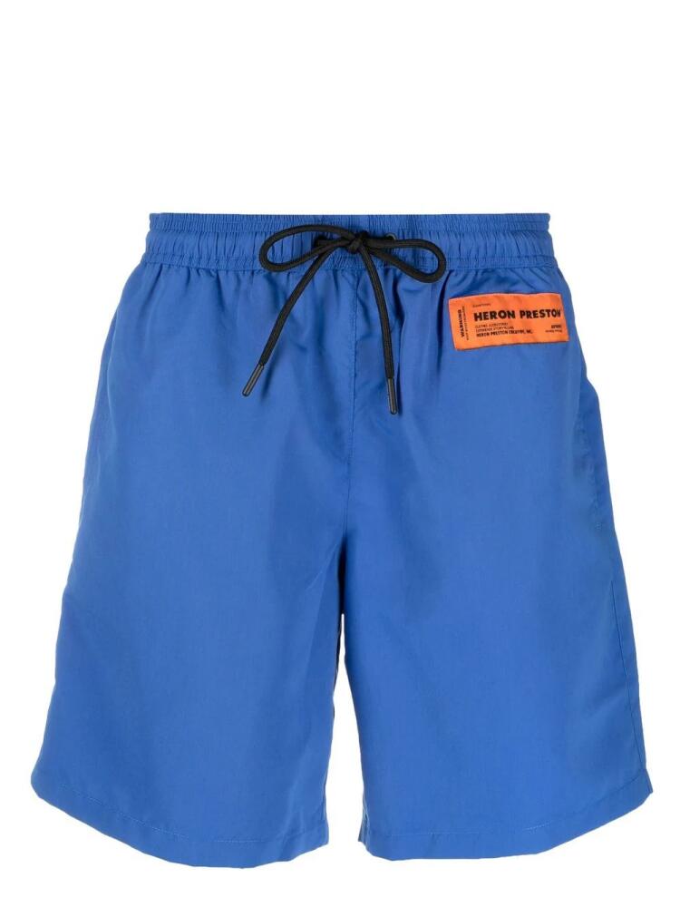 Heron Preston logo-patch drawstring swim shorts - Blue Cover