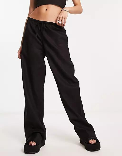 Weekday Mia linen mix pants in black Cover