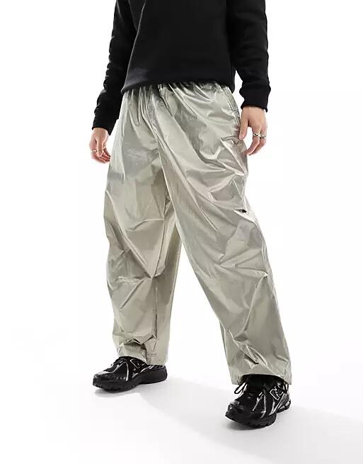 ASOS DESIGN oversized parachute cargo pants in metallic gold Cover