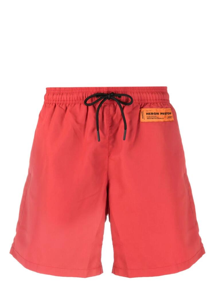 Heron Preston logo-patch drawstring swim shorts - Red Cover