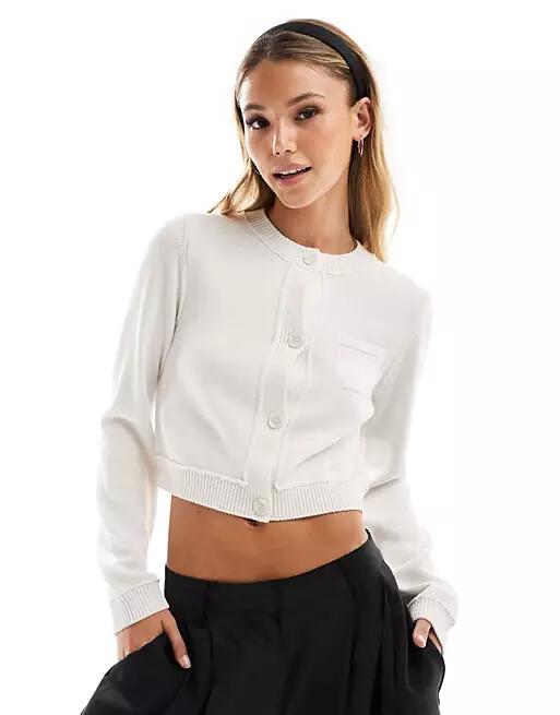 ASOS DESIGN crew neck cropped cardigan with pocket in cotton blend in white Cover