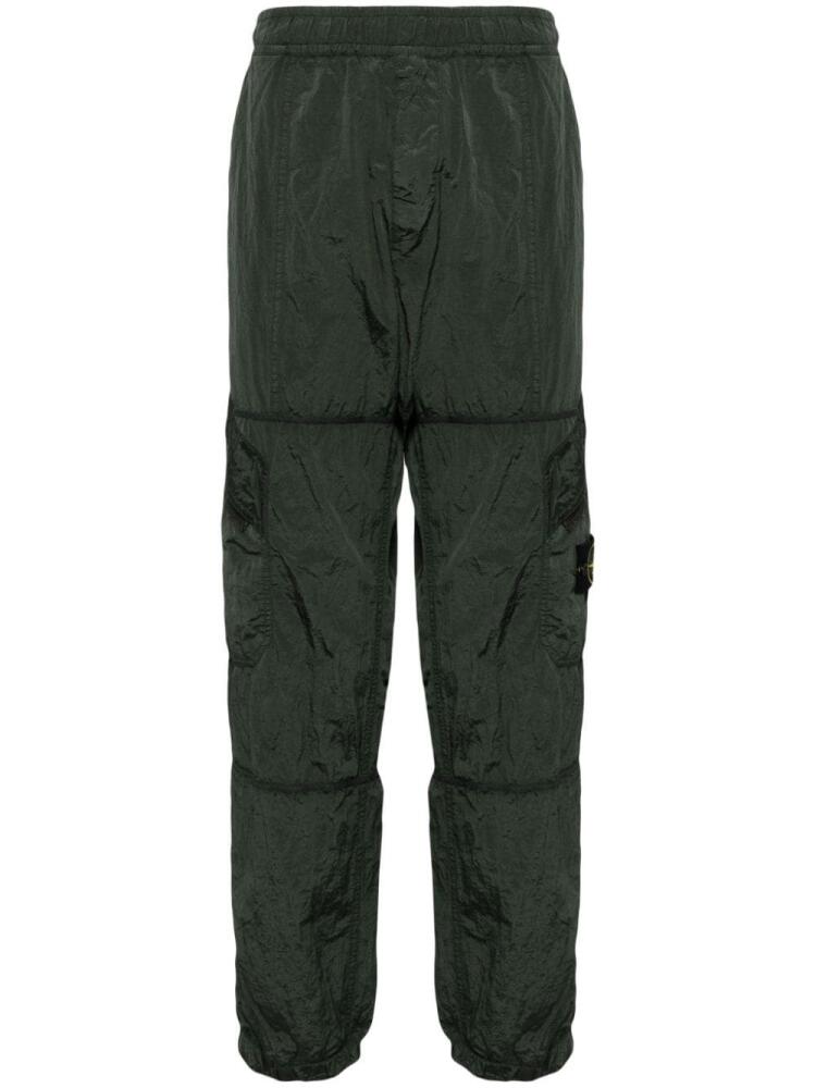 Stone Island Compass-badge crinkled track pants - Green Cover