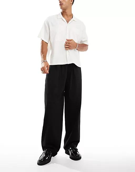 Pull & Bear wide leg tailored pants in black Cover