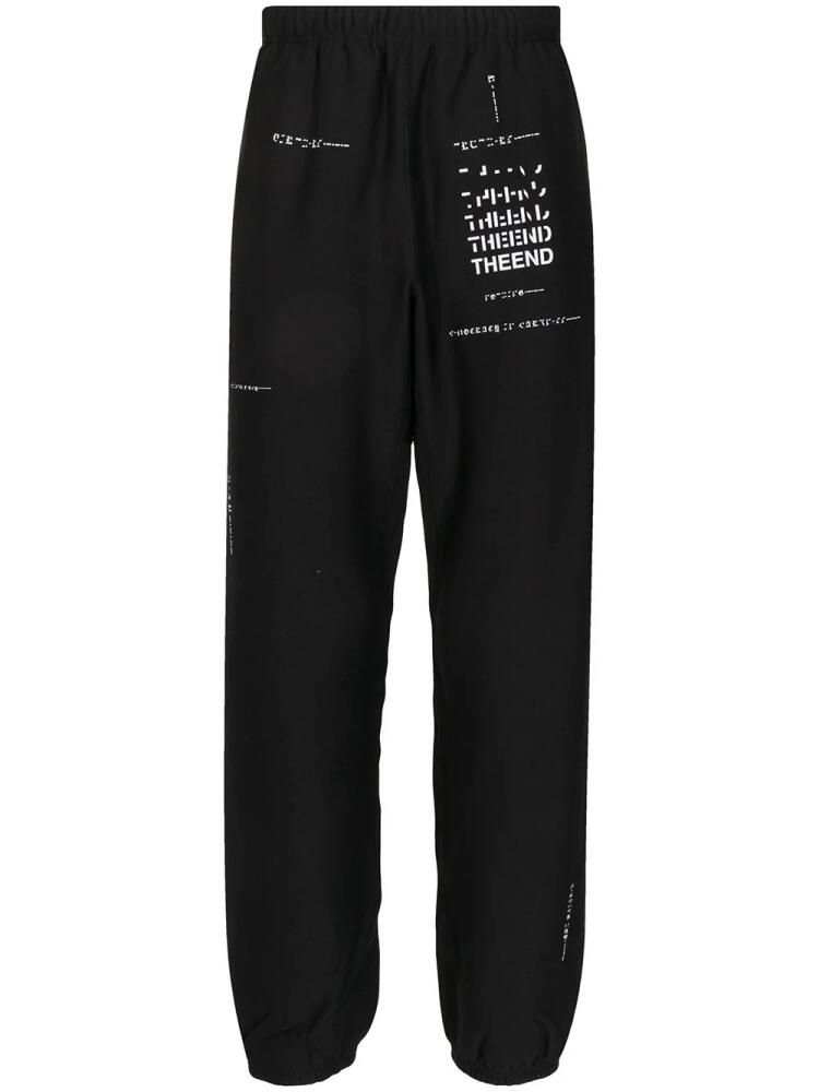 Takahiromiyashita The Soloist slogan-print track pants - Black Cover