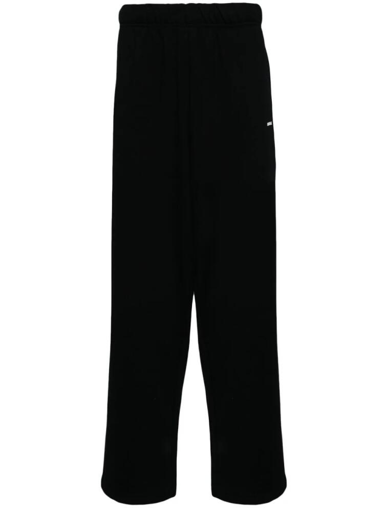 CHOCOOLATE logo-print cotton track pants - Black Cover