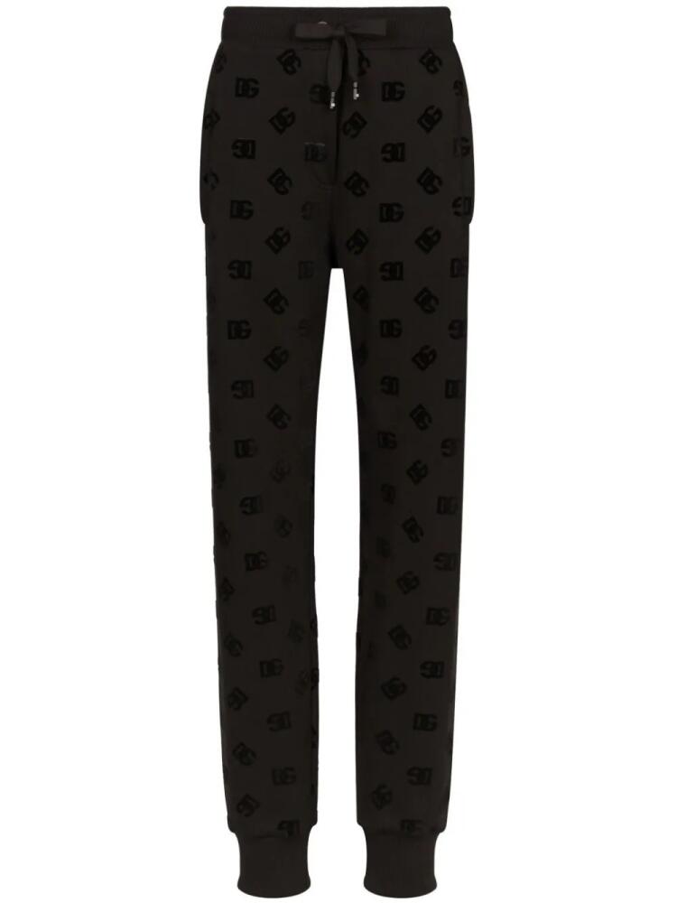 Dolce & Gabbana logo-flocked cotton track pants - Black Cover