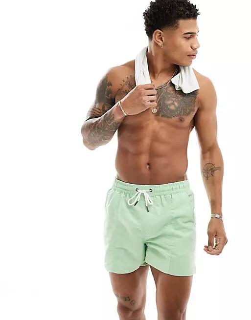 Another Influence swim shorts in sage green Cover