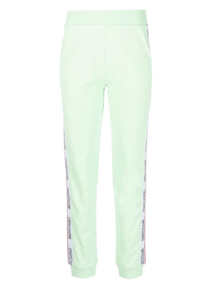 Moschino embossed-logo jersey trousers - Green Cover