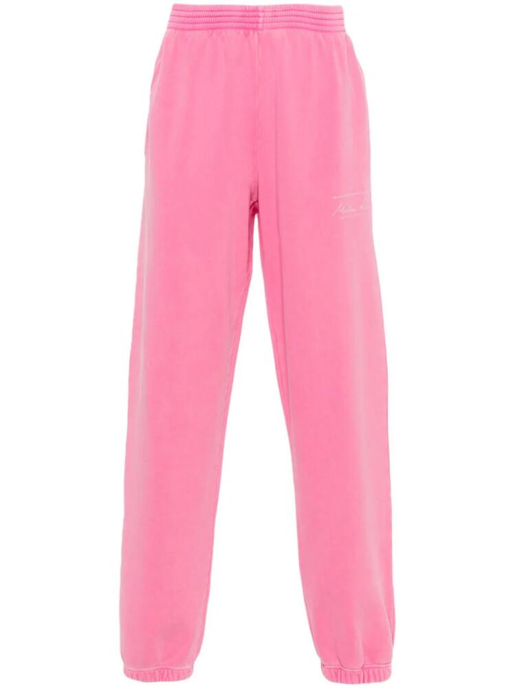 Martine Rose logo-print cotton track pants - Pink Cover