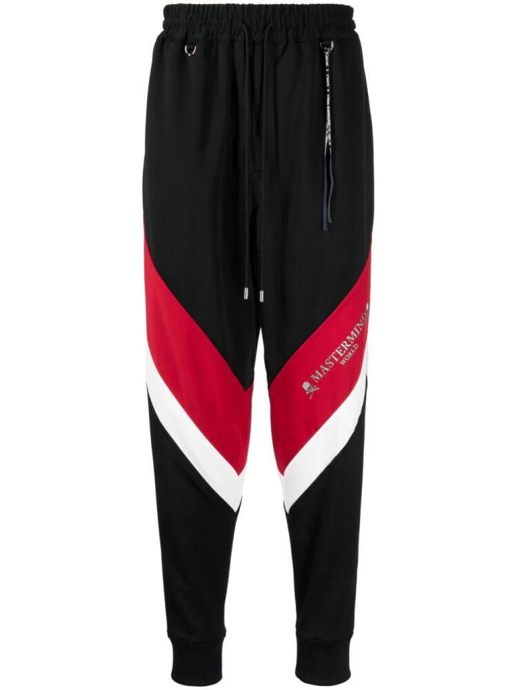 Mastermind World logo-print stripe-detailing track pants - Black Cover