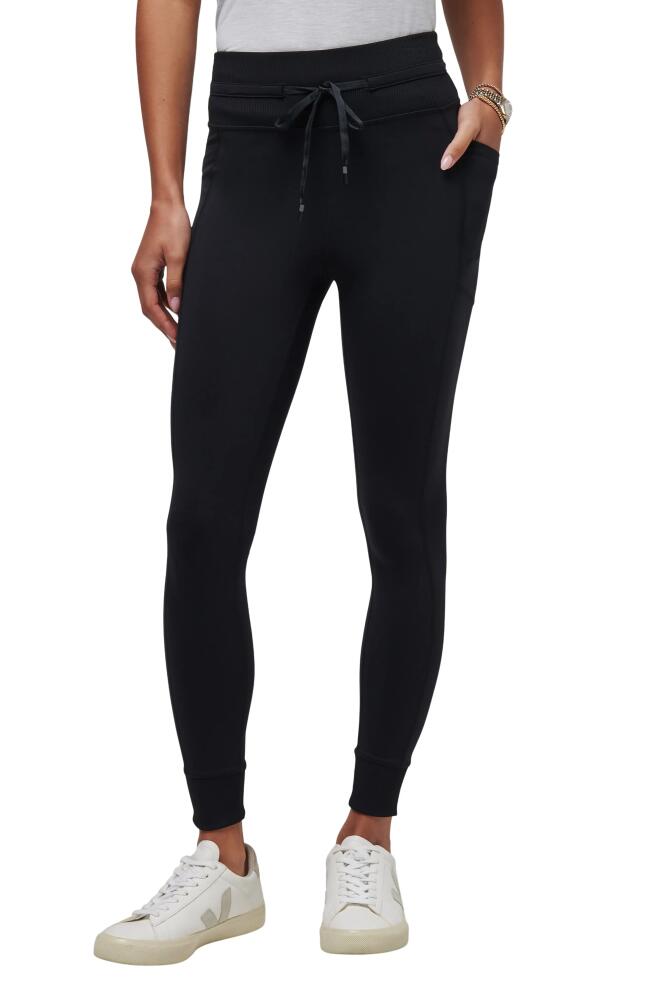 TravisMathew Moveknit Leggings in Black Cover