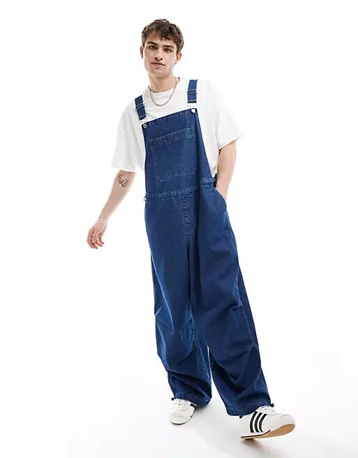 ASOS DESIGN oversized parachute denim overalls in mid wash blue Cover