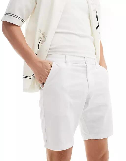 ASOS DESIGN slim stretch chino shorts in white Cover