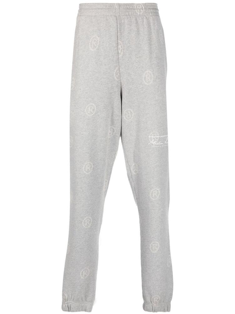 Martine Rose all-over logo-print track pants - Grey Cover