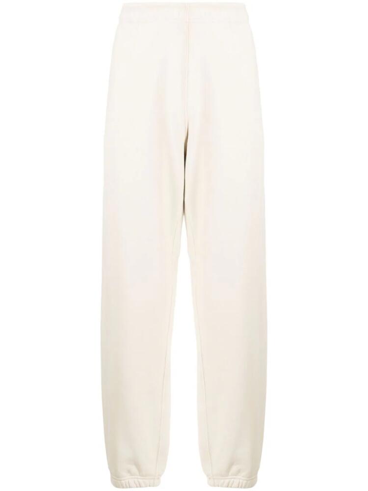 Stone Island logo-appliqué cotton track pants - Neutrals Cover