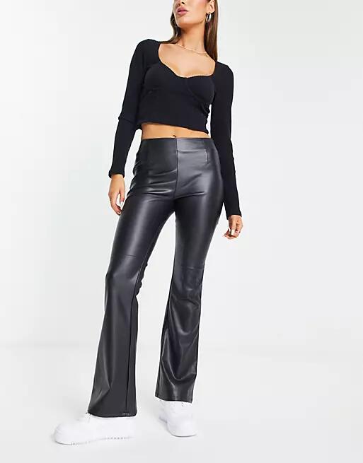 ASOS DESIGN stretch faux leather flare pants in black Cover