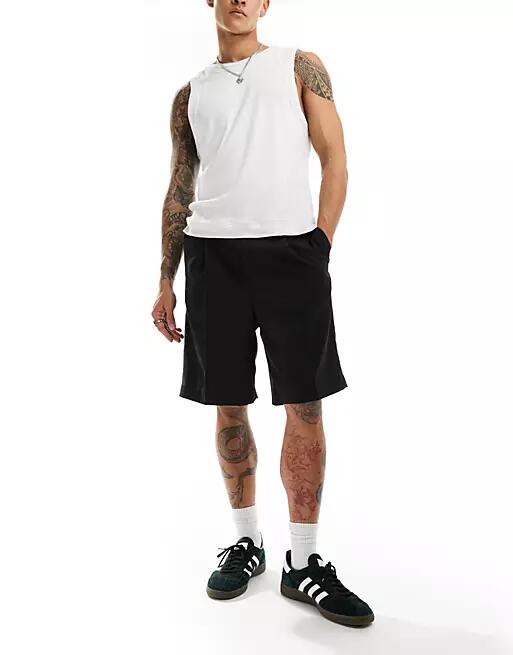 Weekday Uno loose fit tailored shorts in black Cover