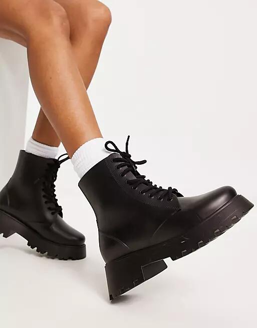 ASOS DESIGN Galaxy chunky lace up wellies in black Cover