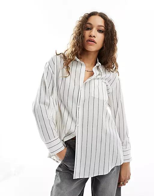 Reclaimed Vintage multi-way asymmetric wrap shirt in black and white pinstripe Cover