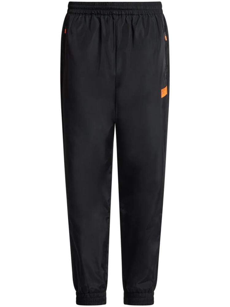 Ea7 Emporio Armani logo-print cotton track pants - Black Cover