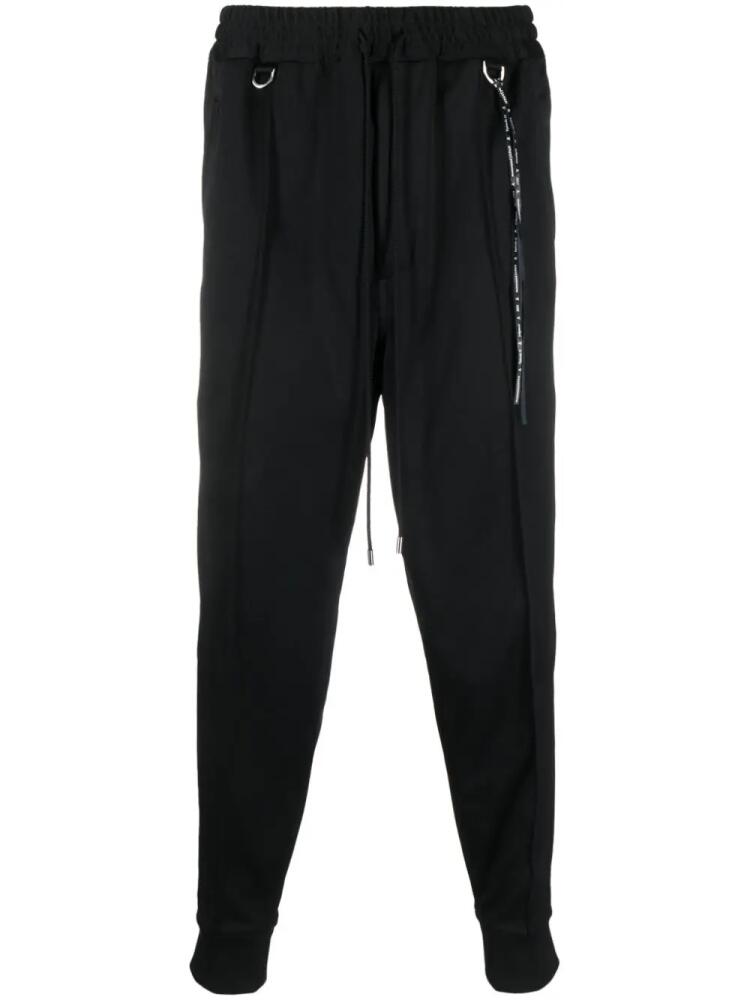 Mastermind Japan skull-tape tapered track pants - Black Cover