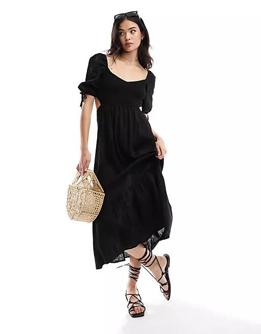 The Frolic fin linen shirred front puff sleeve midi beach dress in black Cover